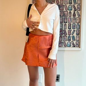 Orange Aritzia satin skirt